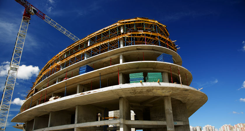 A building under construction with scaffolding around it.