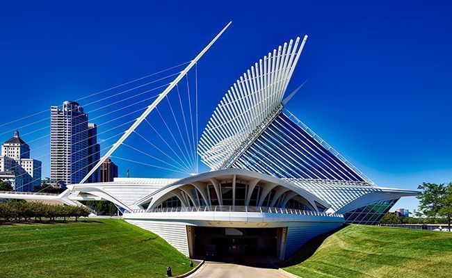 A building with a large white structure on top of it.