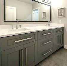 A bathroom with two sinks and a large mirror.